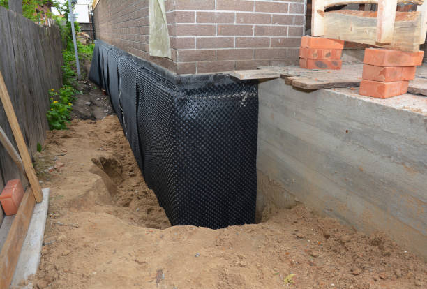 SJ Waterproofing Pros technician performing targeted Basement Waterproofing assessment in Cross Plains, WI